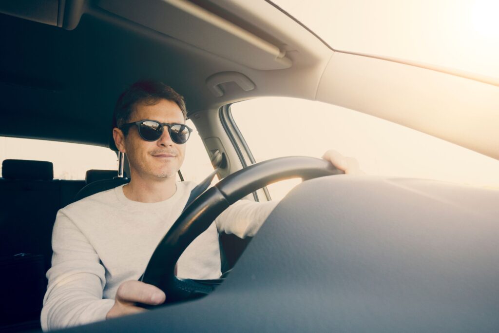 Man enjoying driving car | Symple Loans
